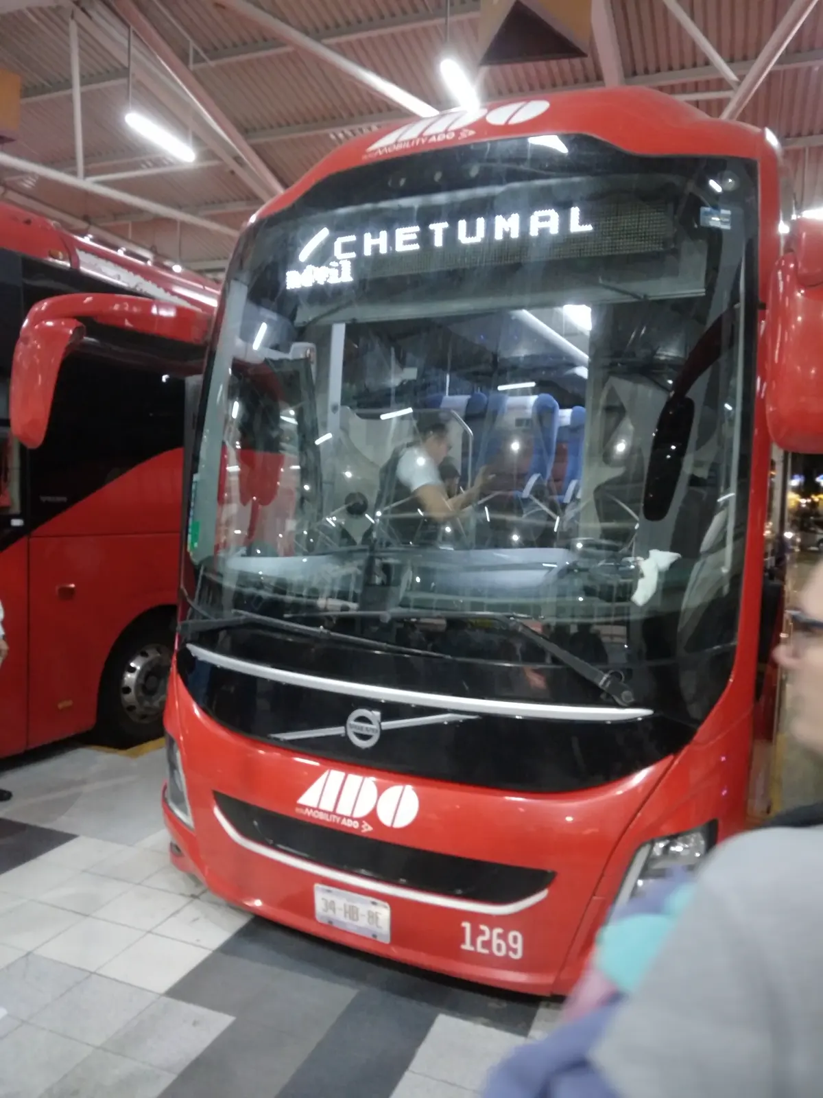 A white and blue ADO coach