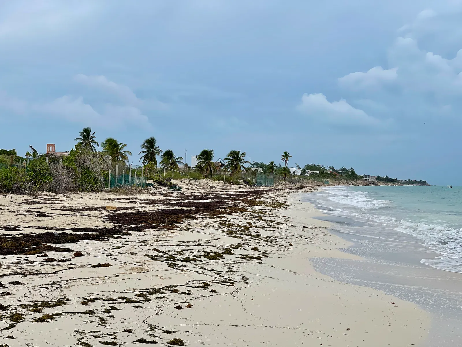 Turquoise water and resort roofs along the Costa Mujeres coast north of Cancun