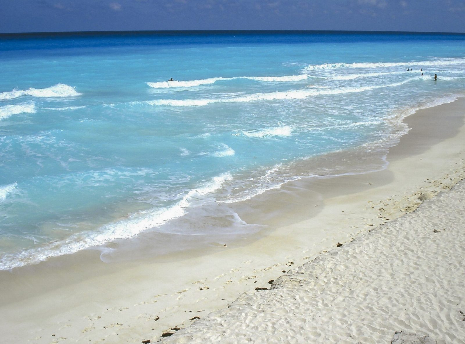 A wide Cancun beach with turquoise water